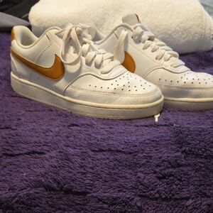 Nike White Sneakers with Metallic Gold Swoosh